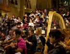 Choir and orchestra rehearse at night